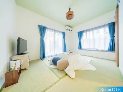 a living room with a bed and a tv at 5min walk to Tokyo Skytree Sta -HANA ASAKUSA- in Tokyo