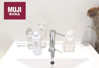 a bathroom sink with bottles of soap and a faucet at 5min walk to Tokyo Skytree Sta -HANA ASAKUSA- in Tokyo