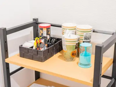 a shelf with pens and cups on a table at 5min walk to Tokyo Skytree Sta -HANA ASAKUSA- in Tokyo