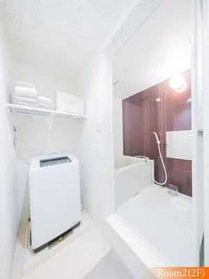 a white bathroom with a sink and a mirror at 5min walk to Tokyo Skytree Sta -HANA ASAKUSA- in Tokyo