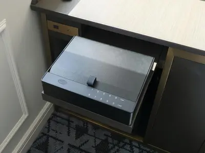 a black box sitting on the floor next to a desk at GINZA HOTEL by GRANBELL in Tokyo