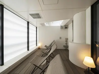 a room with stairs and a large window at GINZA HOTEL by GRANBELL in Tokyo