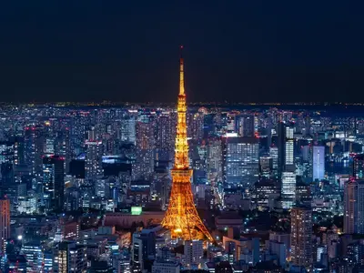 a view of the eiffel tower lit up at night at GINZA HOTEL by GRANBELL in Tokyo