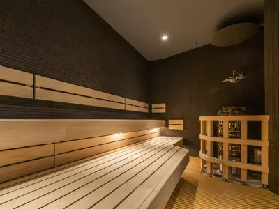 a gymnasium with wooden flooring and a wooden bench at GINZA HOTEL by GRANBELL in Tokyo