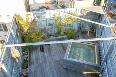 an overhead view of a building with plants on it at PDO INN Coffee & Open-air bath on the roof in Tokyo