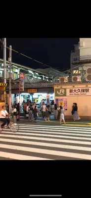 a group of people crossing a street at a crosswalk at \u685c\u306e\u5bbf28 square meter king size bed with sofa bed, garden room102 in Tokyo