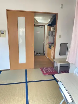 a room with a door open to a room with a bed at \u6771\u6d0b\u306e\u5bb6-26 square meter Treadmi Garden House101 in Tokyo