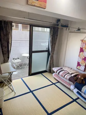a room with a bed and a sliding glass door at \u6771\u6d0b\u306e\u5bb6-26 square meter Treadmi Garden House101 in Tokyo
