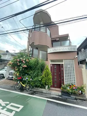 a bike parked in front of a building at \u6771\u6d0b\u306e\u5bb6-26 square meter Treadmi Garden House101 in Tokyo
