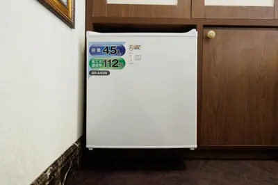 a white refrigerator in a room next to a door at Hotaku HOTEL - Vacation STAY 98852v in Tokyo