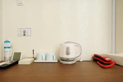 a kitchen counter with a coffee maker and a phone at Hotaku HOTEL - Vacation STAY 98852v in Tokyo
