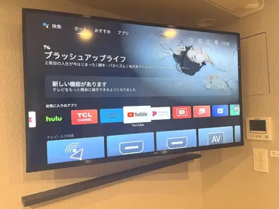 a flat screen tv hanging on a wall at KLASSO Tokyo Sumiyoshi Apartments in Tokyo