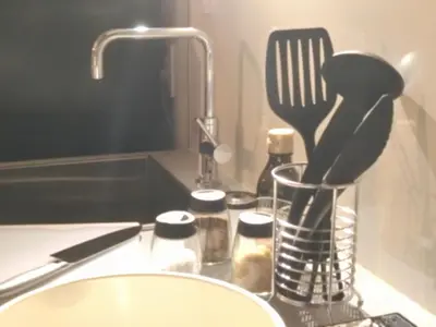 a kitchen counter with a sink with a kitchen utensils at KLASSO Tokyo Sumiyoshi Apartments in Tokyo