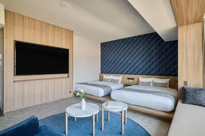 a hotel room with two beds and a tv at fav TOKYO RYOGOKU in Tokyo