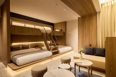 a bedroom with two beds and a living room at fav TOKYO RYOGOKU in Tokyo