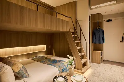 a bedroom with a bunk bed and a staircase at fav TOKYO RYOGOKU in Tokyo
