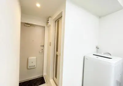 a white bathroom with a toilet and a sink at Beverly Homes Osaki by Tranova in Tokyo