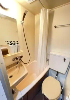 a small bathroom with a toilet and a sink at Beverly Homes Osaki by Tranova in Tokyo