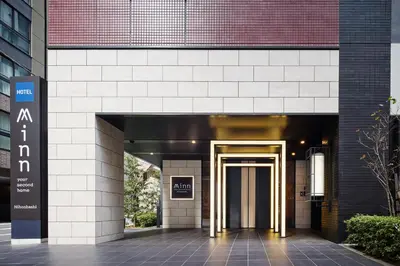 an entrance to a building with a gold door at Minn Nihonbashi in Tokyo