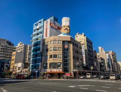 a building with a statue of a chef on top of it at Minn Asakusa Kappabashi in Tokyo