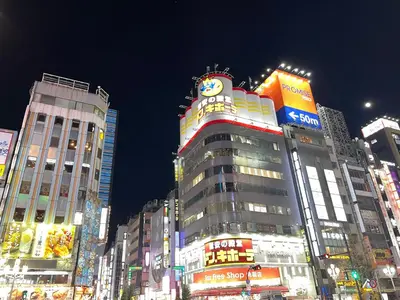 a tall building with a clock on the top of it at HOTEL AMANEK Shinjuku Kabukicho in Tokyo