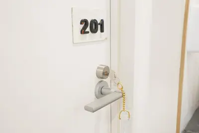 an open door with a number on it at Hostel Lodging Tokyo Uguisudani in Tokyo