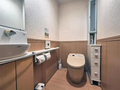 a small bathroom with a toilet and a sink at Tokyo House INN in Tokyo