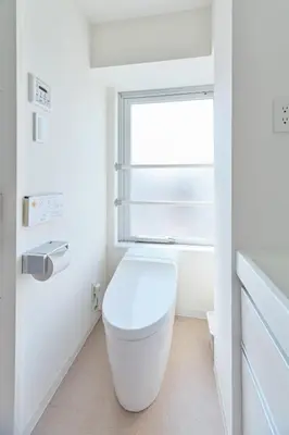 a white bathroom with a toilet and a window at TORA HOTEL Sensoji \u5bc5\u30db\u30c6\u30eb \u6d45\u8349\u5bfa in Tokyo