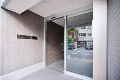 an entrance to a building with a glass door at TORA HOTEL Sensoji \u5bc5\u30db\u30c6\u30eb \u6d45\u8349\u5bfa in Tokyo