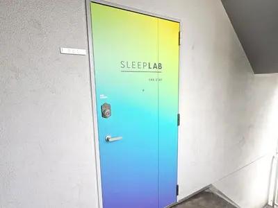 a blue door with the words sleep pad on it at SLEEPLAB THE STAY \u829d\u6d66 -Shibaura- in Tokyo