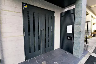 a black door on the side of a building at SLEEPLAB THE STAY \u829d\u6d66 -Shibaura- in Tokyo