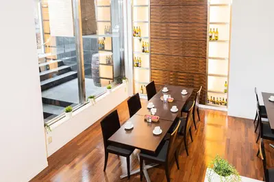 a dining room with a table and chairs at Kanda Station Hotel in Tokyo