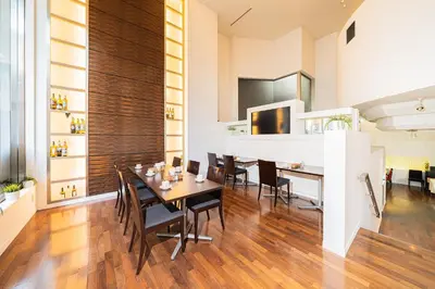 a dining room with a table and chairs at Kanda Station Hotel in Tokyo