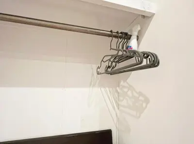 a towel rack hanging from a wall in a bathroom at SHIBUYA HOUSE in Tokyo