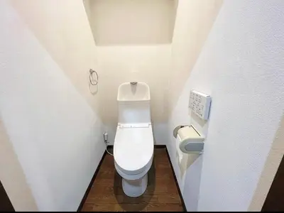 a small bathroom with a toilet in a stall at SHIBUYA HOUSE in Tokyo