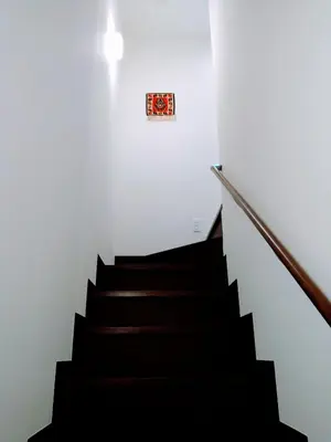 a stairway with black stairs and a sign on the wall at Tokyo stay Hut SARI - Vacation STAY 27239v in Tokyo