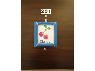 a picture of a cherry ornament hanging on a wall at Tokyo stay Hut SARI - Vacation STAY 27260v in Tokyo