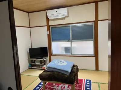 a room with a chair in front of a window at D-pdal Inn - Vacation STAY 39054v in Tokyo