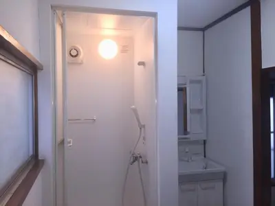 a white bathroom with a sink and a toilet at D-pdal Inn - Vacation STAY 38493v in Tokyo