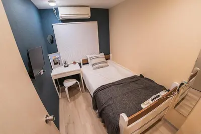 a hospital room with a bed and a desk at Business Hotel Kankokukan - Vacation STAY 41182v in Tokyo