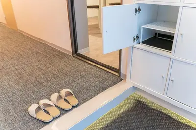 a pair of sandals sitting on the floor in a room at Business Hotel Kankokukan - Vacation STAY 41182v in Tokyo