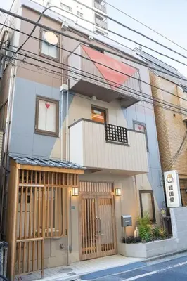 a building with a wooden gate in front of it at Business Hotel Kankokukan - Vacation STAY 41182v in Tokyo