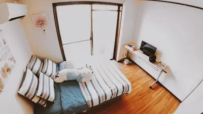 a living room with a couch and a television at City Pal 