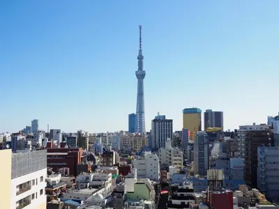a view of a city with a tower in the background at Far East Village Hotel Tokyo, Asakusa in Tokyo