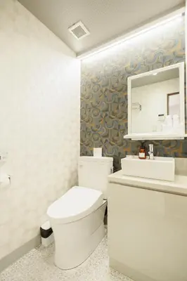 a bathroom with a toilet and a sink and a mirror at Hotaku HOTEL - Vacation STAY 98860v in Tokyo