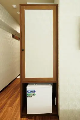 a room with a door and a white refrigerator at Hotaku HOTEL - Vacation STAY 98860v in Tokyo