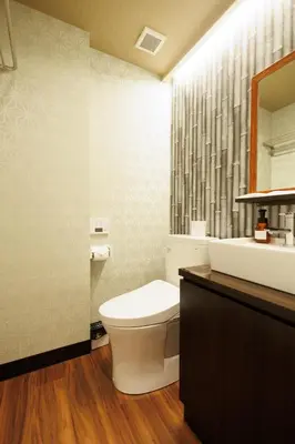 a bathroom with a toilet and a sink and a mirror at Hotaku HOTEL - Vacation STAY 98860v in Tokyo