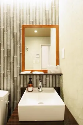 a bathroom with a white sink and a mirror at Hotaku HOTEL - Vacation STAY 98860v in Tokyo