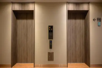 a elevator in a building with two elevators at OTHER SPACE Asakusa in Tokyo