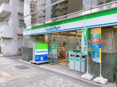 a familymart store on a city street at KOSUMOSU Ikebukuro Shinjuku Private House in Tokyo